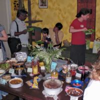 wafflers congregate around vegan waffle toppings