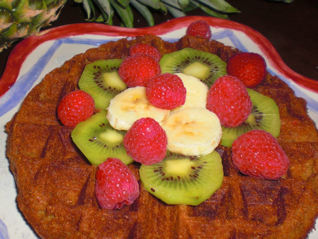 vegan waffles with bananas, kiwi, and raspberries