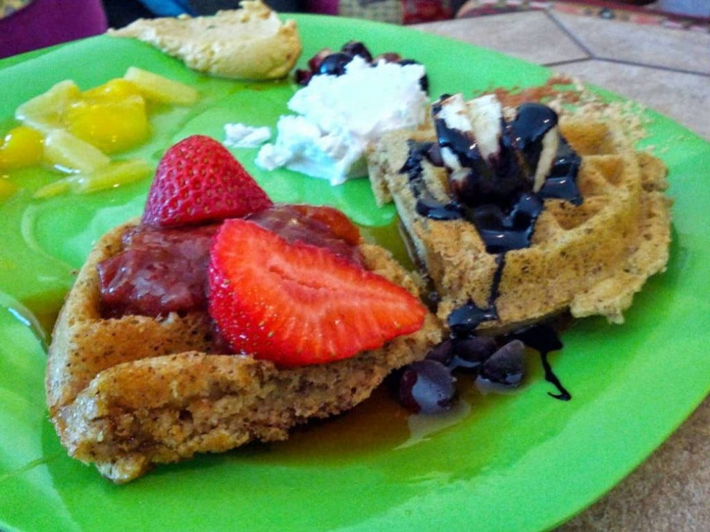 vegan waffles with strawberries & chocolate syrup