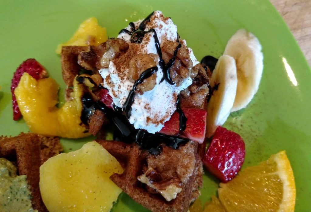 vegan waffle with banana, fruit, & chocolate closeup