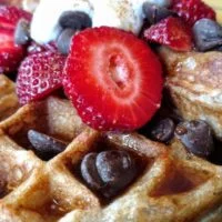 vegan waffle with strawberries and chocolate chips